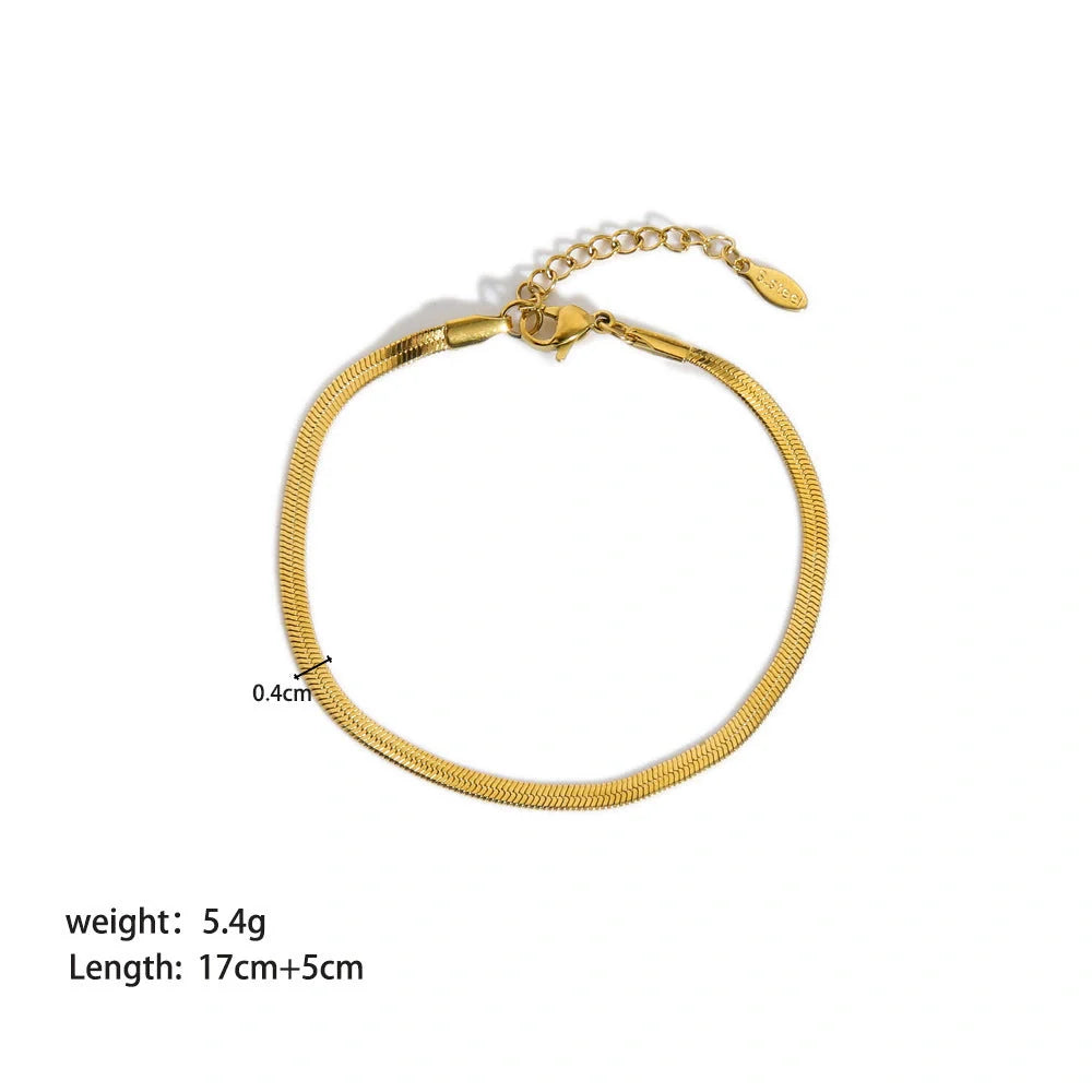 Stainless steel bracelet with real gold treatment in various colours, featuring geometry shapes and ring elements