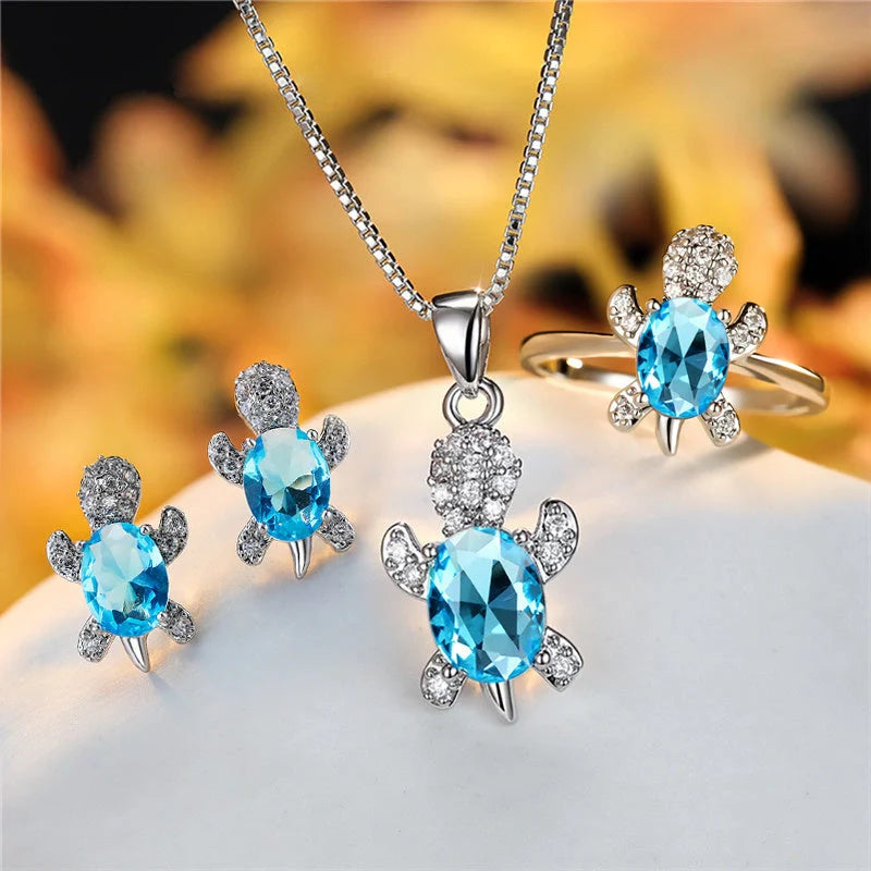 Stylish turtle pendant necklace with vibrant rainbow stones, perfect for women and children.