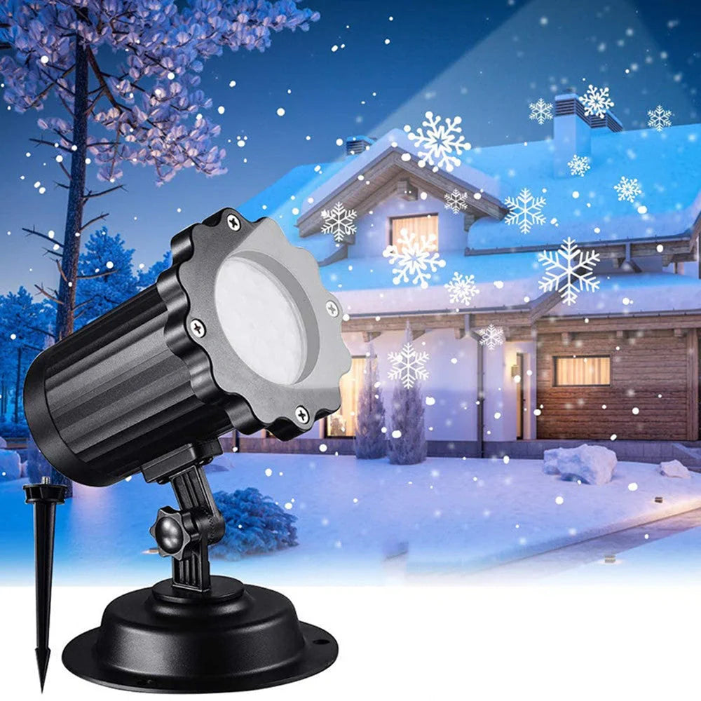 LED Christmas Blizzard Snowflake Laser Light Projector illuminating a garden with white snowflake patterns