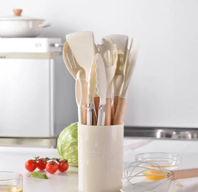 Silicone kitchenware set with wooden handles in various colors and styles, perfect for cooking, baking, and serving