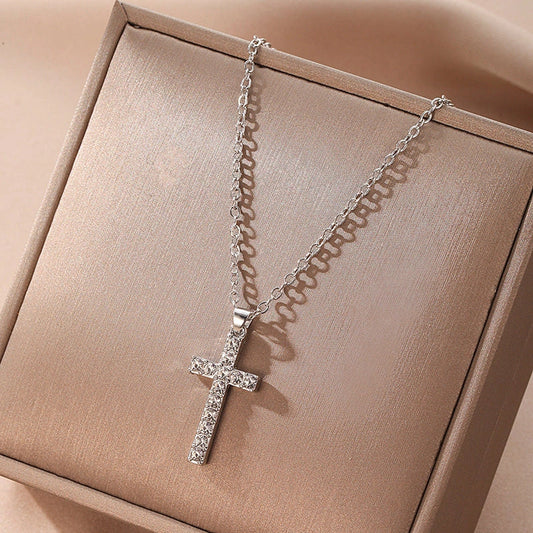 Elegant silver-toned Jesus cross pendant necklace with sparkling artificial gems, showcasing premium British craftsmanship