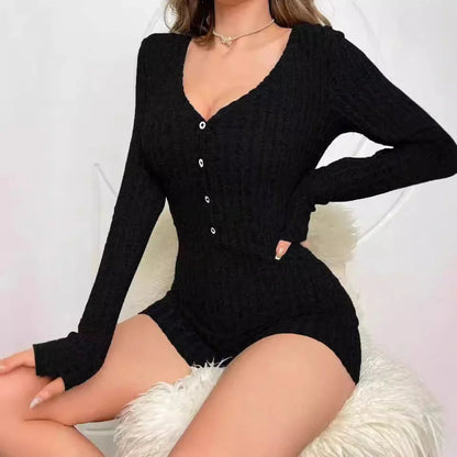 Elegant rib-knit jumpsuit in various colours, featuring a relaxed waistline and tapered legs for a sleek, flattering silhouette