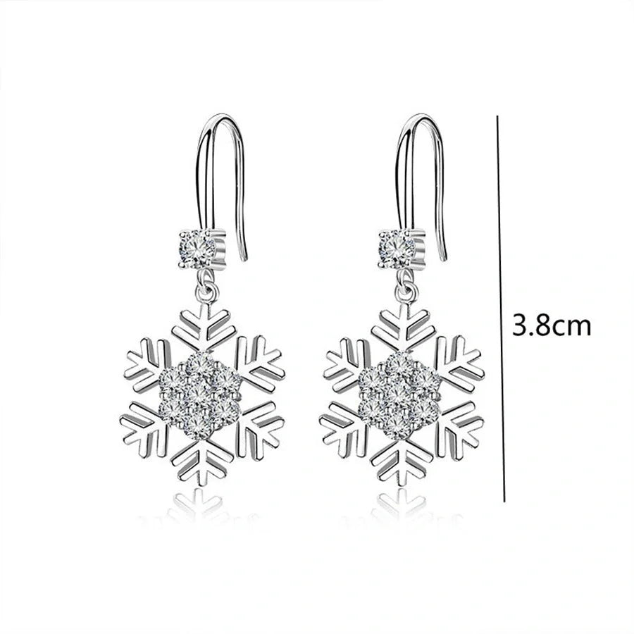 Elegant snowflake earrings with sparkling rhinestones, a festive fashion accessory for women