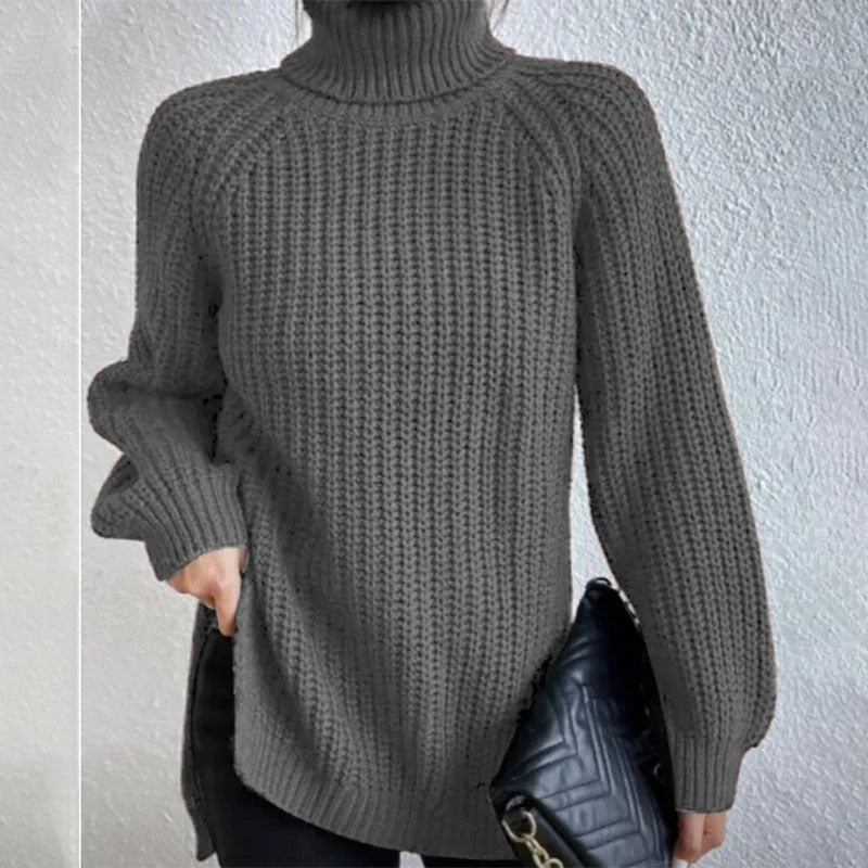 A stylish turtleneck pullover sweater with a unique split design, available in a variety of classic colours and sizes.