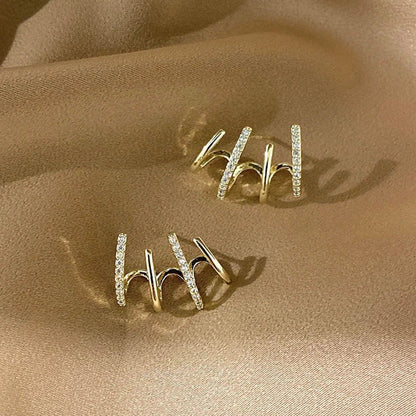 Radiant sterling silver earrings with four-prong zircon stone settings, elegant and fashionable jewelry for women