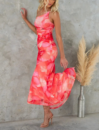 Floral one-shoulder dress in various colours, featuring a unique design and comfortable polyester fabric for effortless summer style.