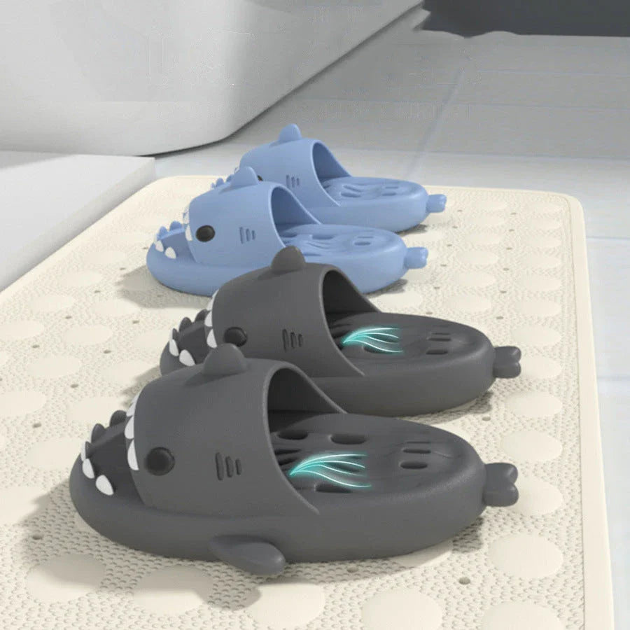 Fashionable shark-themed shower slides with drainage holes, featuring a realistic shark design, quick-drying EVA material, and non-slip traction.