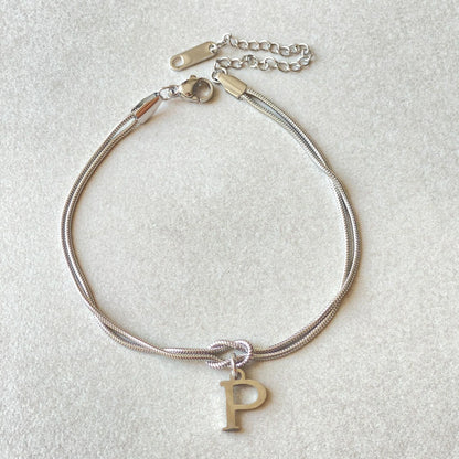 Personalised gold and silver love knot bracelets for couples, perfect as Valentine's Day gifts.