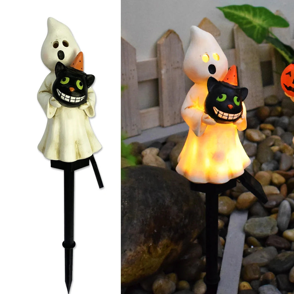 Solar-powered Halloween pumpkin lanterns in garden setting