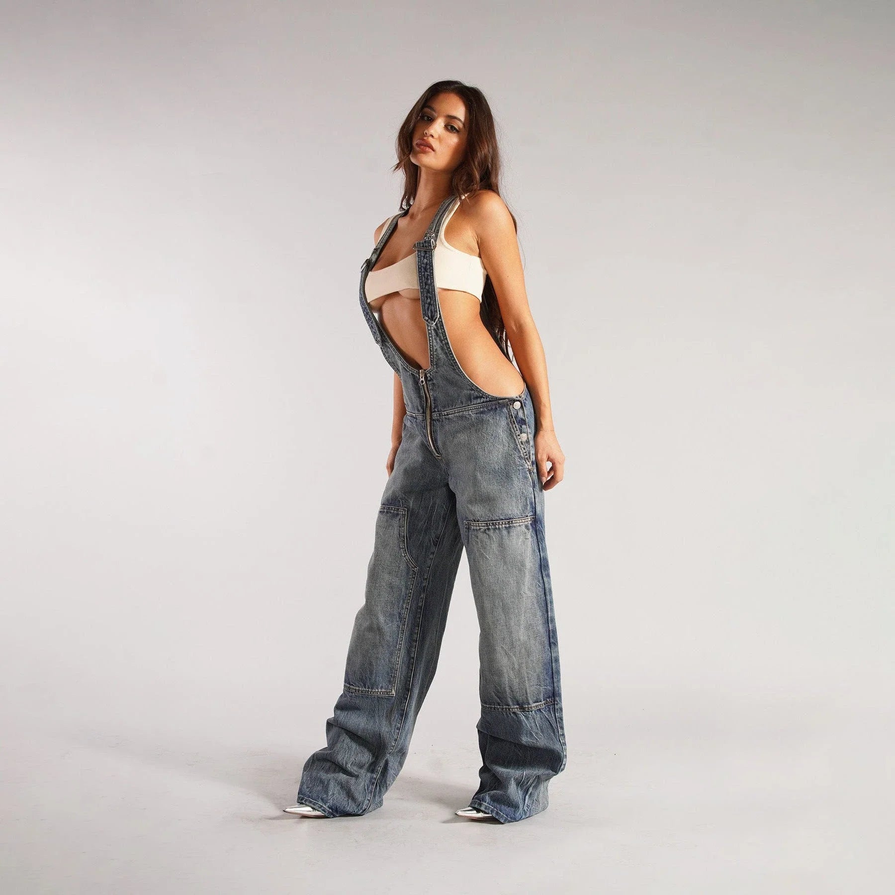 Stylish denim overalls with adjustable suspender straps, front and back pockets, and a comfortable micro-elastic fit, available in a variety of chic colors.