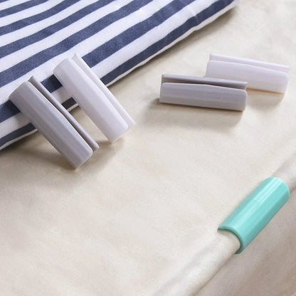 Non-slip sheet fixing clips in various colours for securing bedding and cushions