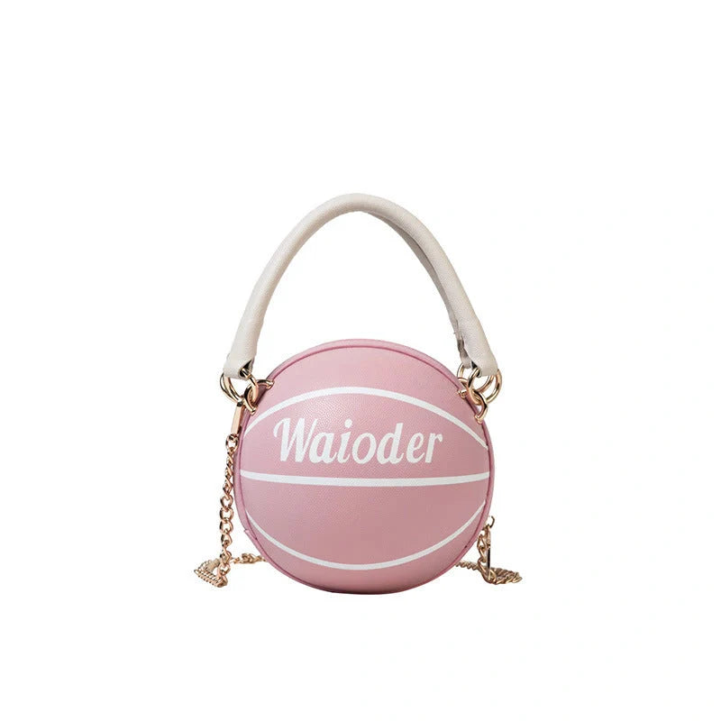 Basketball-shaped handbag in pink, white, black, or brown with adjustable chain shoulder strap