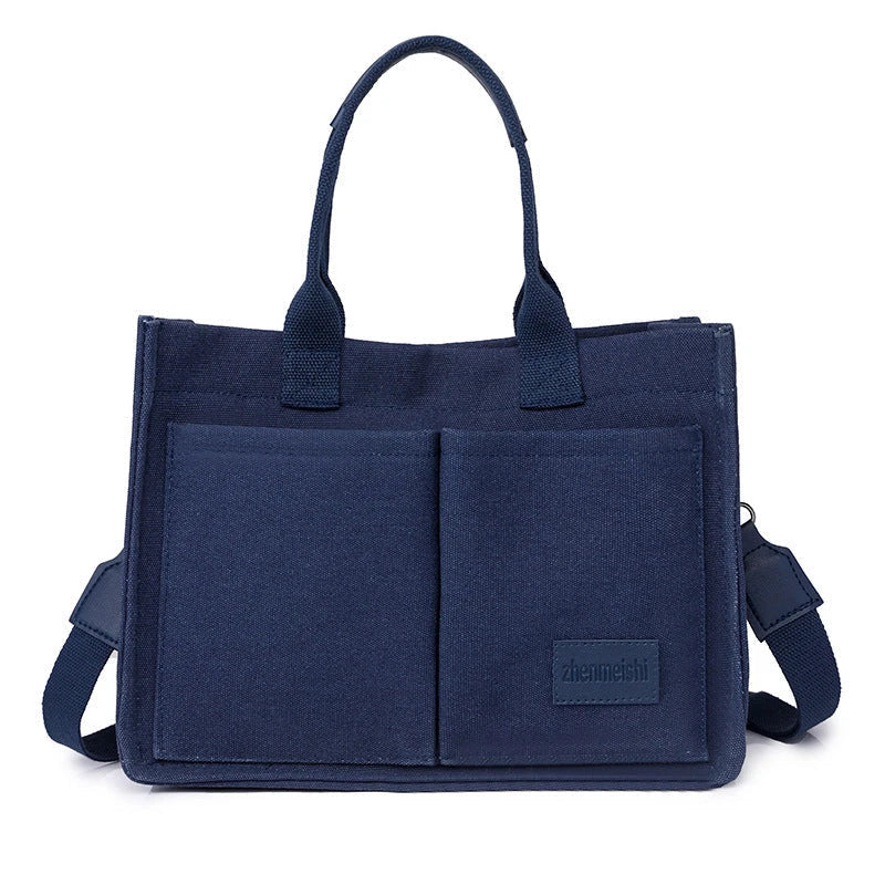 Stylish and durable canvas tote bag with multiple pockets for everyday use