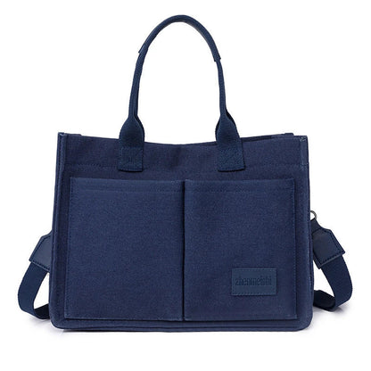 Stylish and durable canvas tote bag with multiple pockets for everyday use