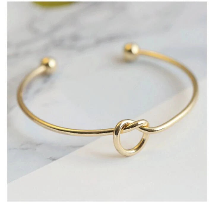 Elegant knotted O-type metal openwork bracelet in various colours