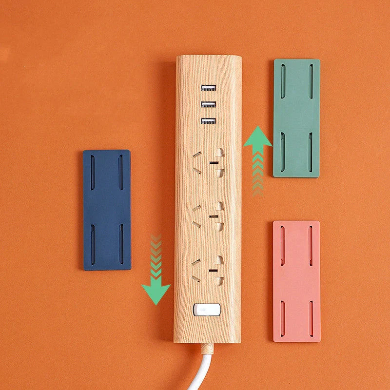 Self-adhesive wall hook in green, blue, white, and pink for cable organisation