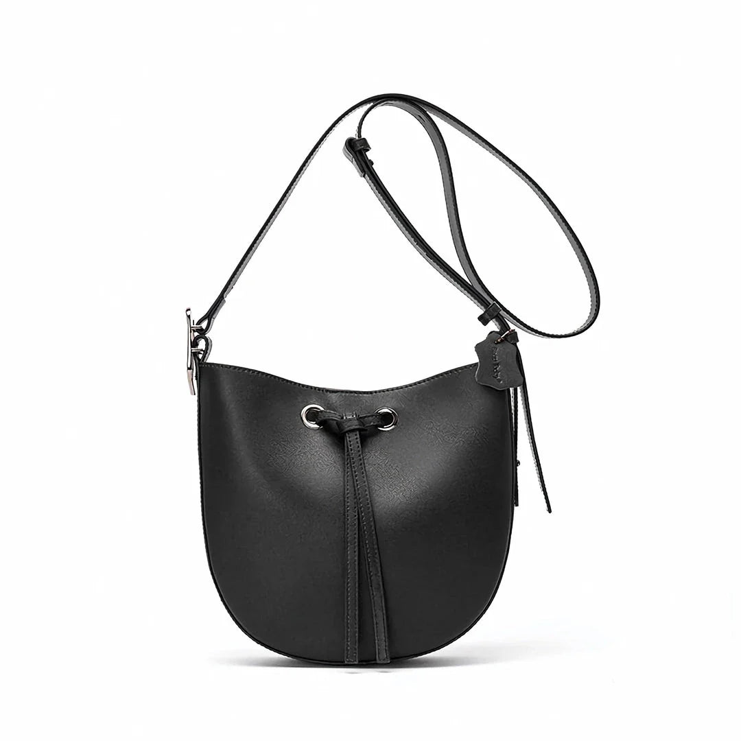 Elegant black leather bucket handbag with a metal buckle detail and adjustable strap