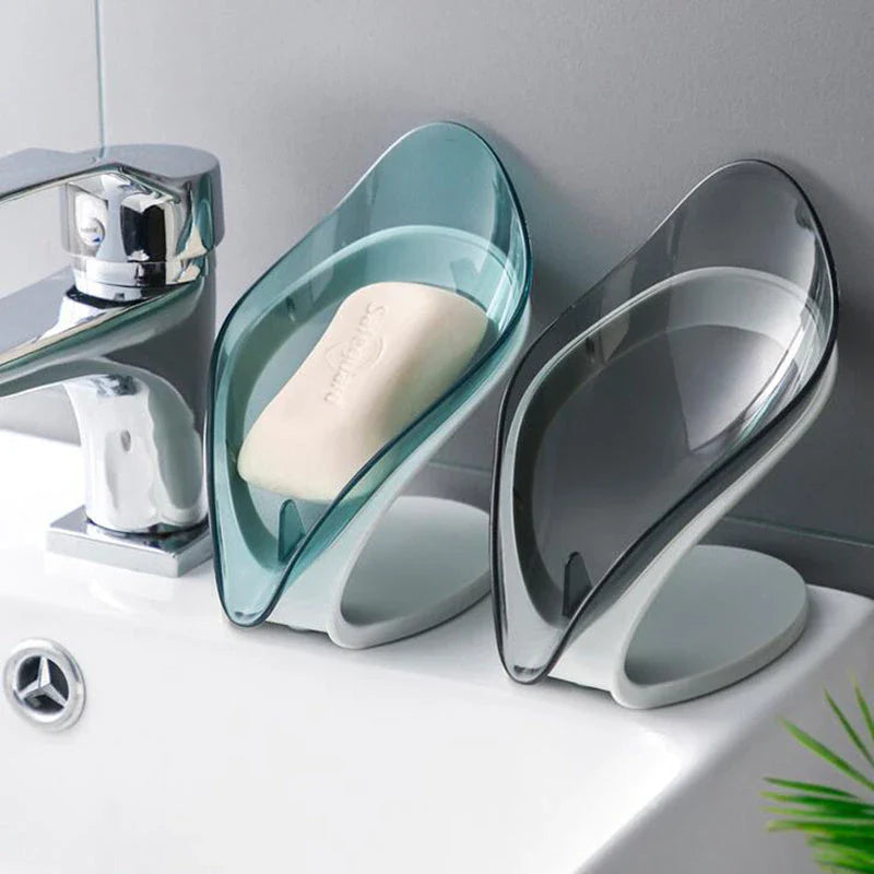 Elegant leaf-shaped soap dish with self-draining design and stable triangular shape, made of durable ABS material