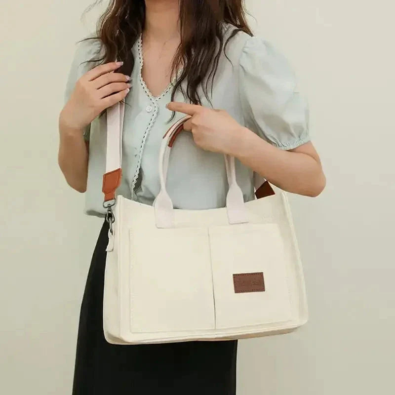 Stylish and durable canvas tote bag with multiple pockets for everyday use