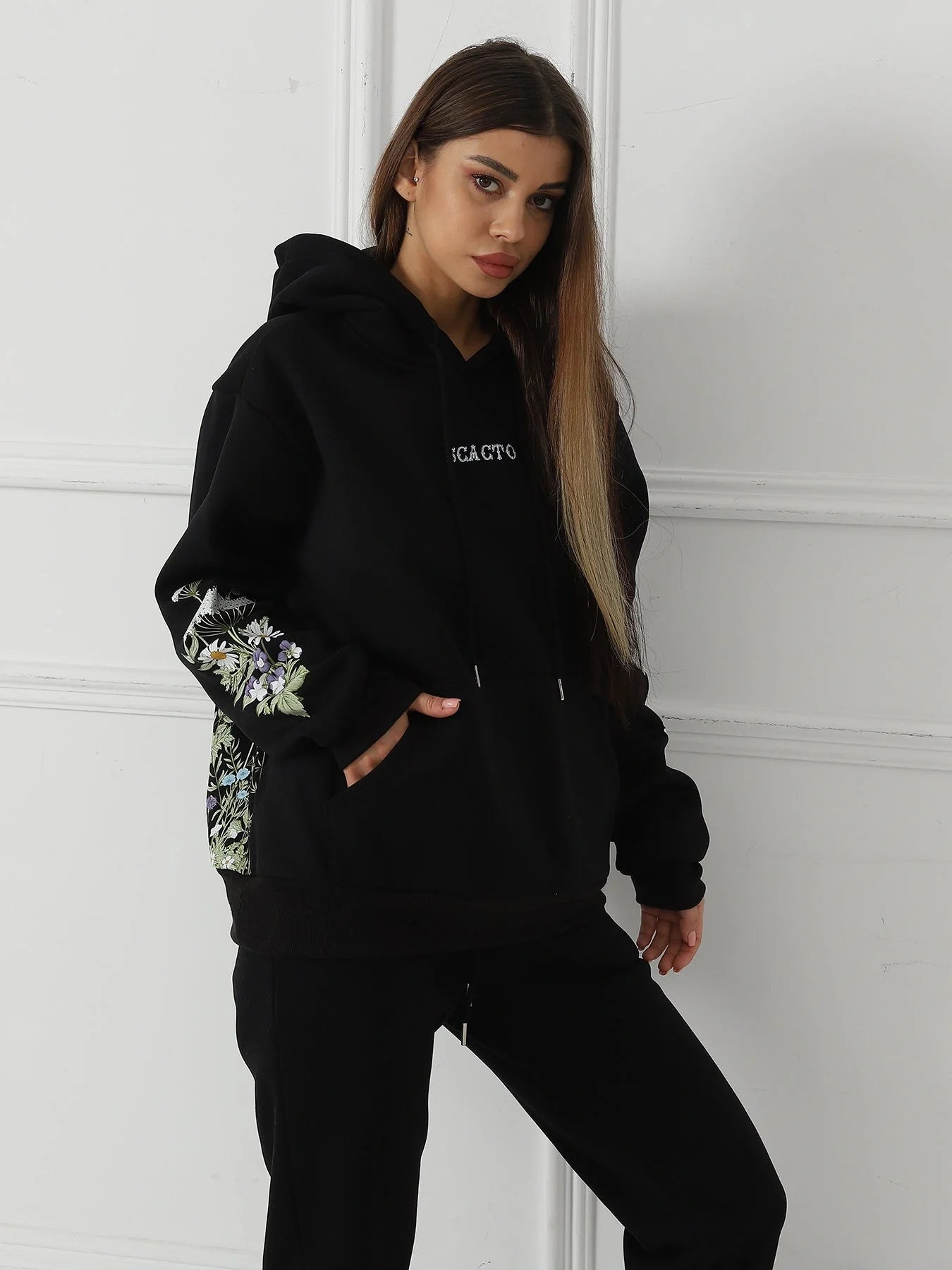 Women's floral long sleeved sweatshirt in black, blue, and apricot