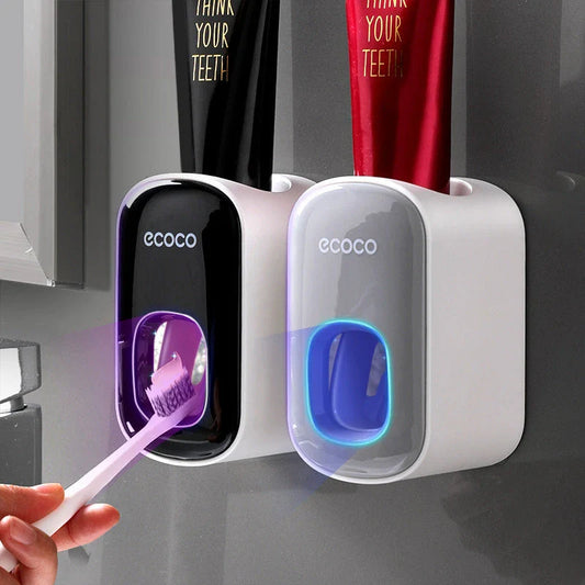 Wall-mounted automatic toothpaste dispenser with storage cups for toothbrush and bathroom accessories