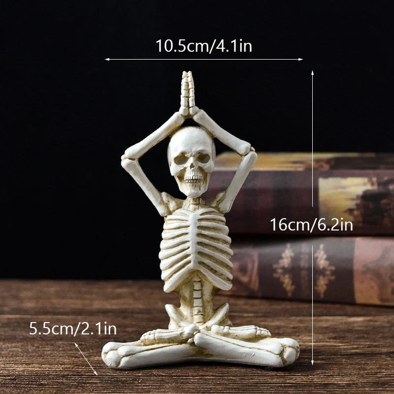 Haunting Halloween desktop ornaments, featuring intricate resin skulls and skeletons in black and vintage white finishes