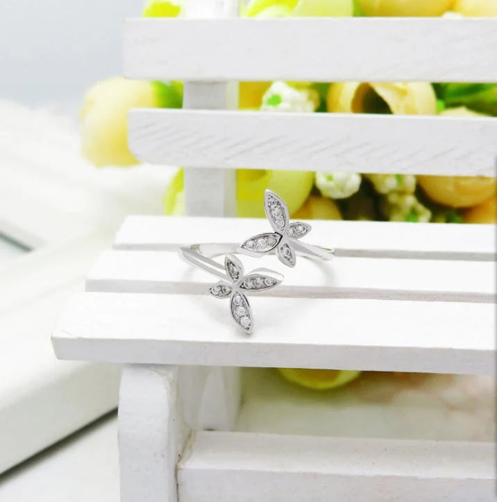 Sterling Silver Adjustable Butterfly Ring with gem accents on a white background