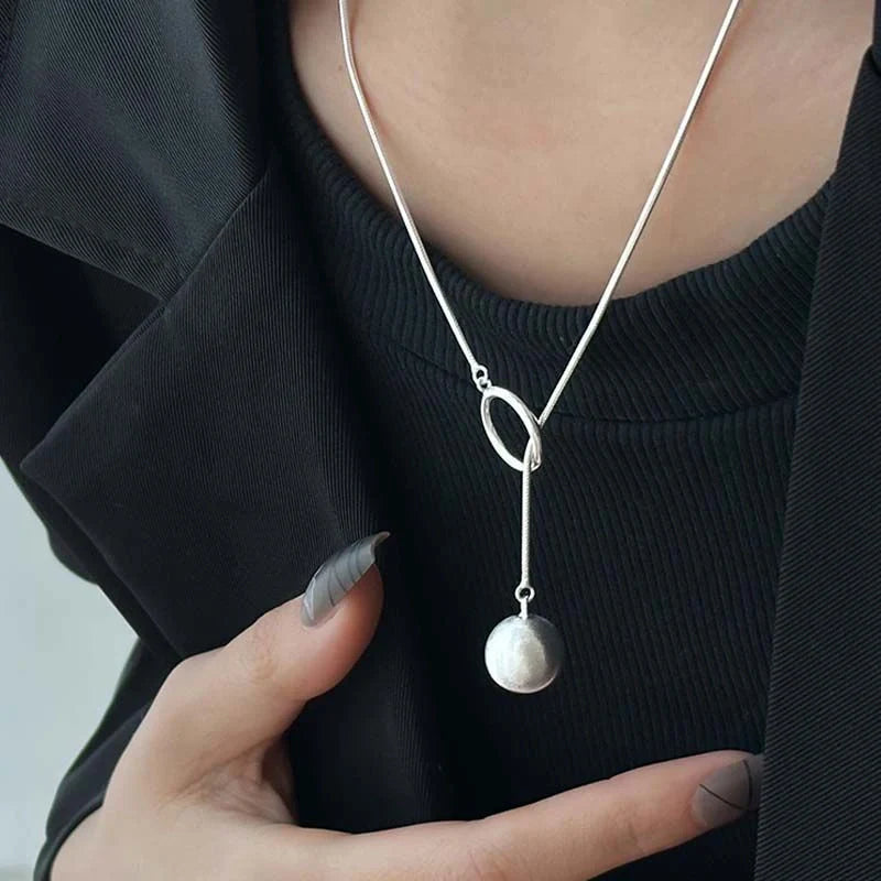 Platinum-plated round ball necklace with snake-bone chain, a versatile and elegant accessory for fashion-forward British women