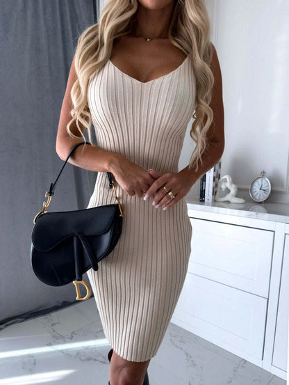 A stylish 2-piece outfit featuring a long-sleeve striped top and a suspender skirt in various colors.