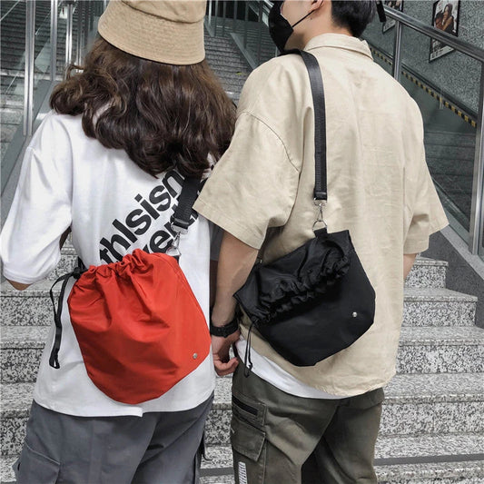 Stylish nylon drawstring waist bag with diagonal design, adjustable fit, and practical storage compartments