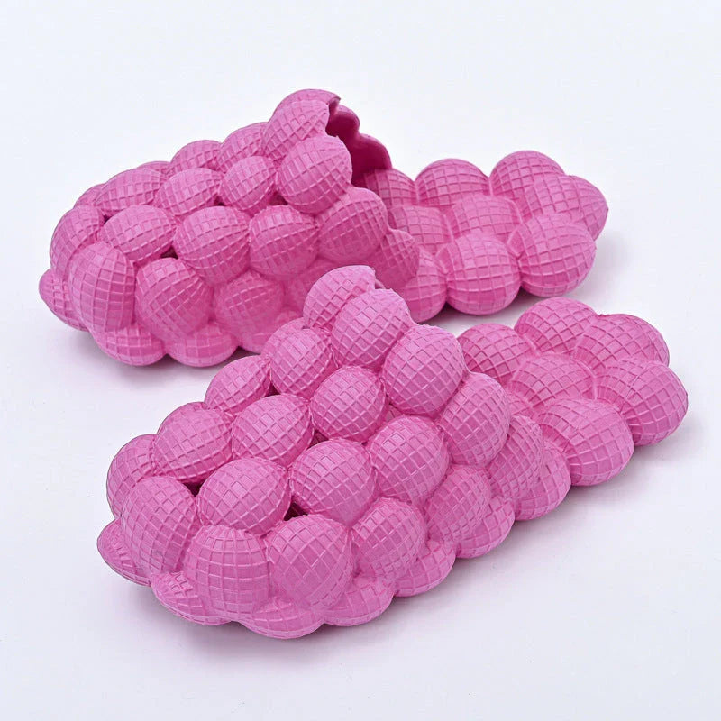Comfortable massage bubble slides with breathable mesh upper and non-slip soles for indoor relaxation and pampering