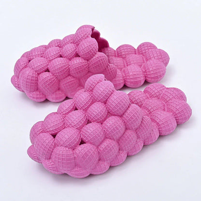 Comfortable massage bubble slides with breathable mesh upper and non-slip soles for indoor relaxation and pampering