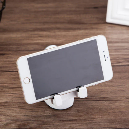 Charming astronaut-themed mobile phone stand made of high-quality resin, designed to securely hold your phone on your desk or workspace
