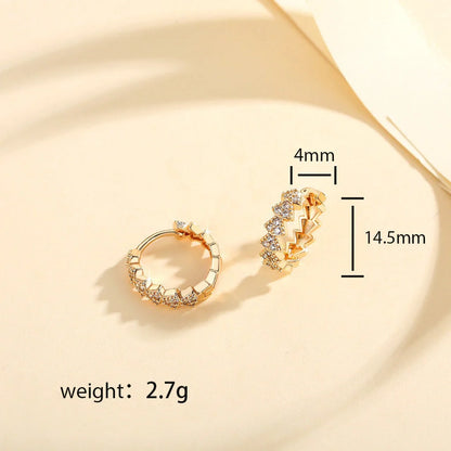 Premium copper-plated gold and zircon stud earrings in a classic design, exuding British elegance and sophistication