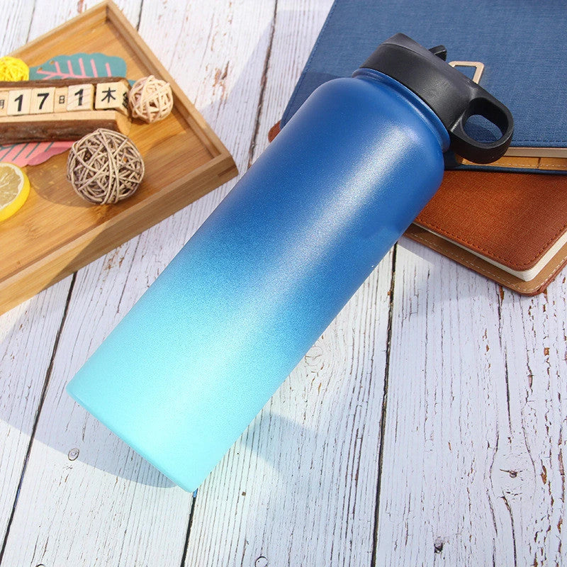 Premium stainless steel insulated tumbler with push-button lid and sleek design for outdoor adventures and active lifestyles.
