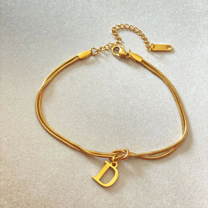 Personalised gold and silver love knot bracelets for couples, perfect as Valentine's Day gifts.