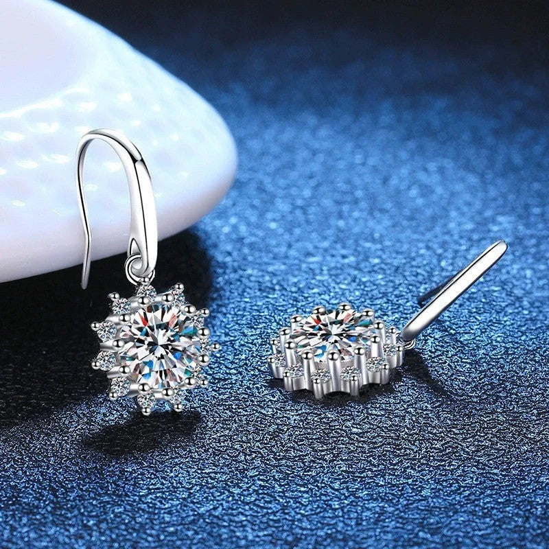 A pair of elegant sunflower-shaped ear studs in a gleaming white gold tone, showcasing the intricate floral design and premium craftsmanship.