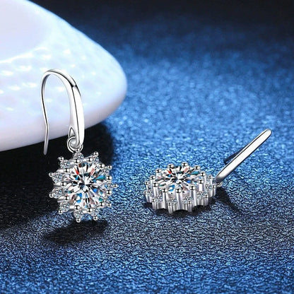 A pair of elegant sunflower-shaped ear studs in a gleaming white gold tone, showcasing the intricate floral design and premium craftsmanship.