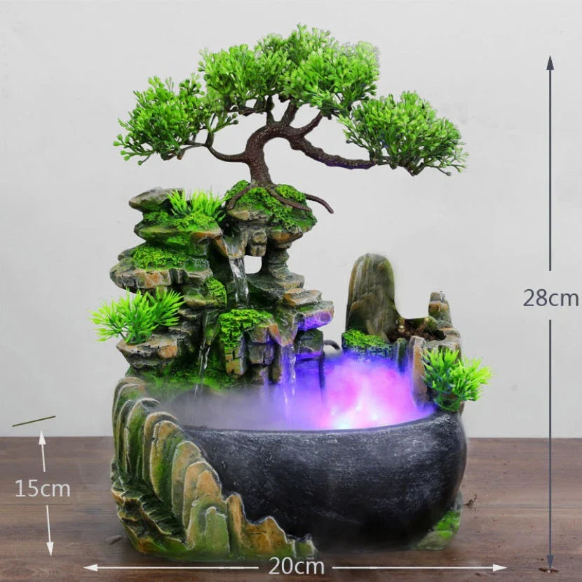 A desktop water feature with a rockery design, flowing water, and an optional mist function for creating a calming and relaxing ambience in home or office spaces.