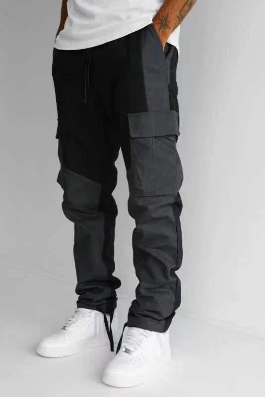 Men's large pocket stitching trousers in black and grey, featuring multiple pockets and a loose fit.