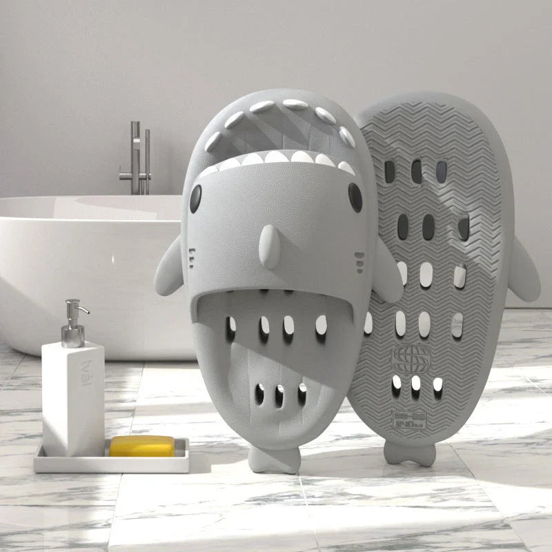 Fashionable shark-themed shower slides with drainage holes, featuring a realistic shark design, quick-drying EVA material, and non-slip traction.