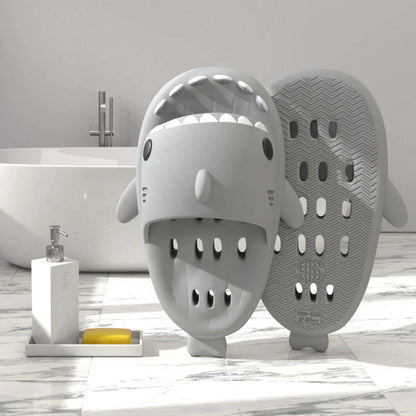 Fashionable shark-themed shower slides with drainage holes, featuring a realistic shark design, quick-drying EVA material, and non-slip traction.