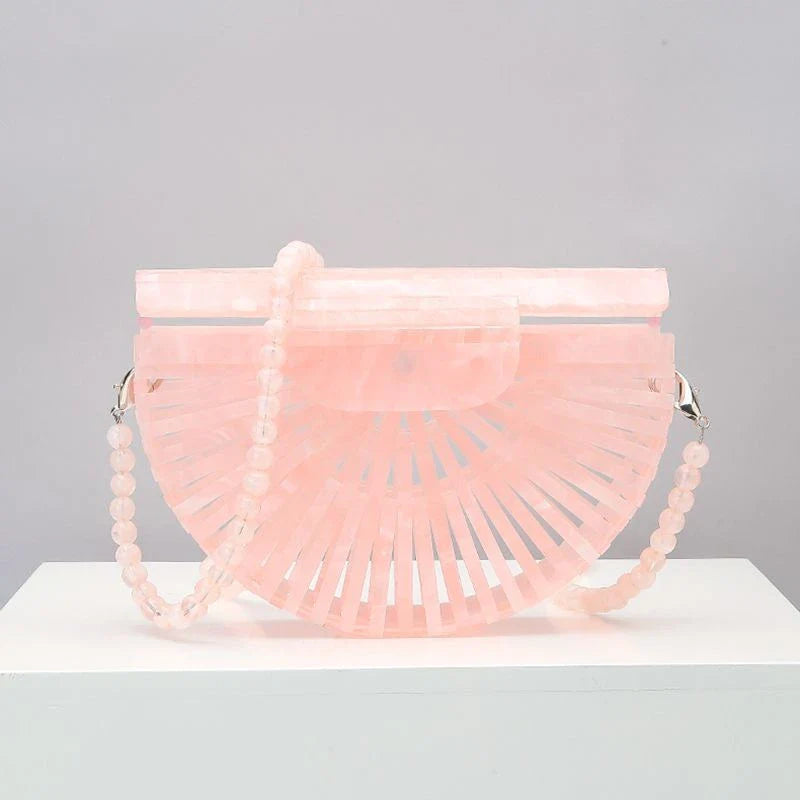 Stylish acrylic cross-body bag in various colors and strap designs, perfect for everyday use and fashion-forward British style.