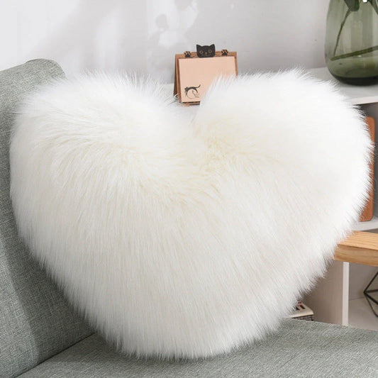 Cozy heart-shaped throw pillow with plush, shaggy texture in various colors