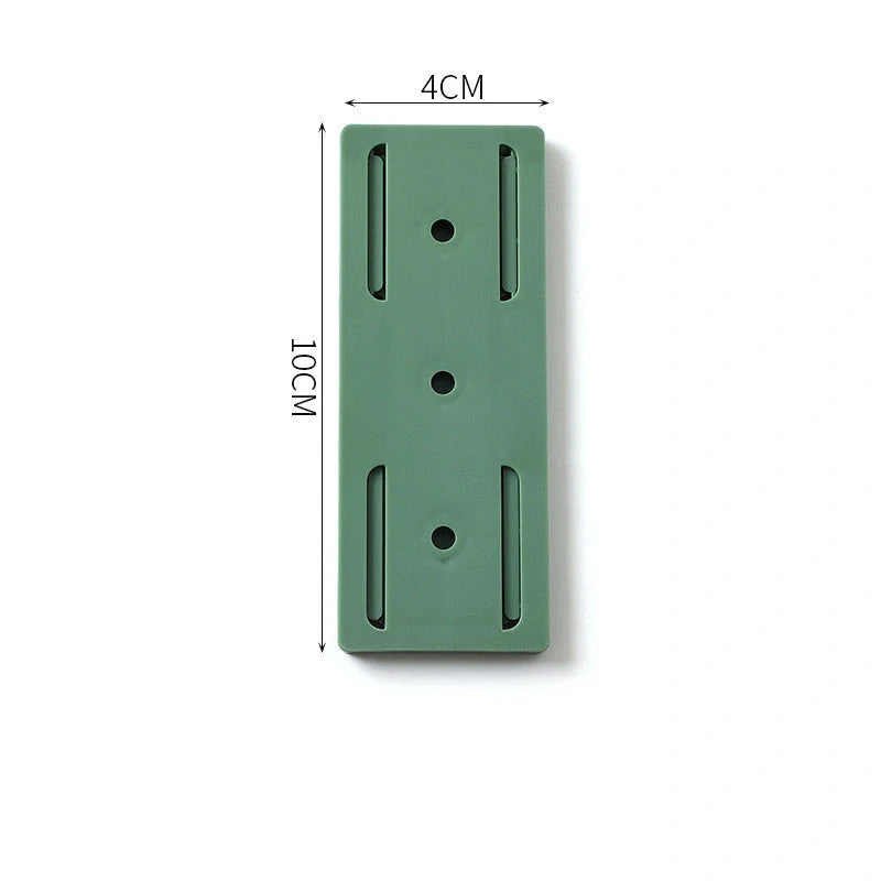 Self-adhesive wall hook in green, blue, white, and pink for cable organisation