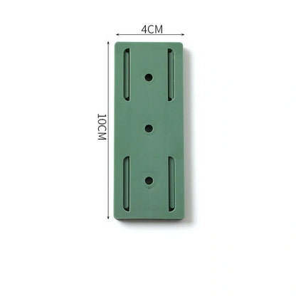 Self-adhesive wall hook in green, blue, white, and pink for cable organisation