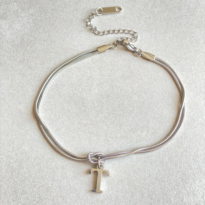 Personalised gold and silver love knot bracelets for couples, perfect as Valentine's Day gifts.