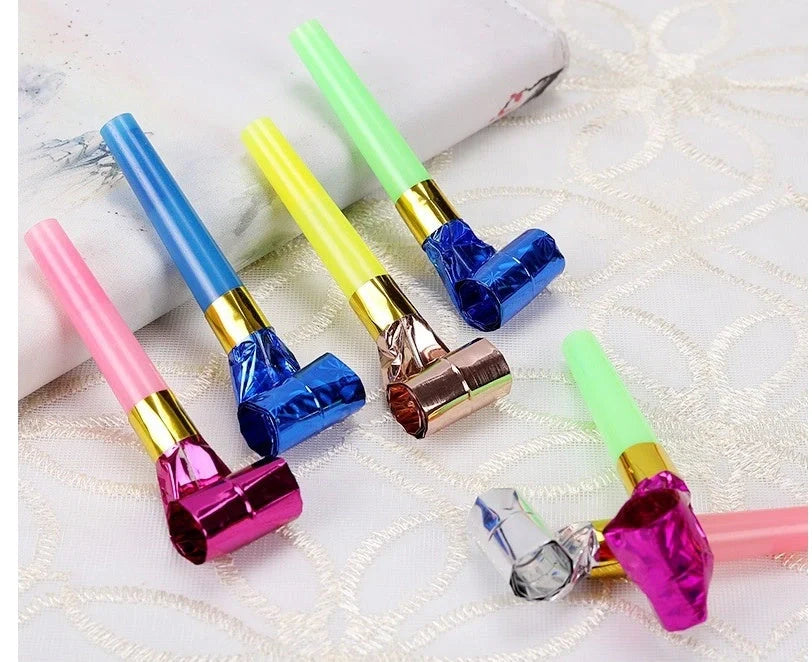 Colourful dragon-themed party favours made of high-quality plastic, including sticks and hammers in a variety of vibrant hues