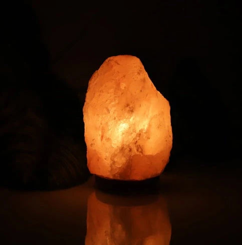Natural rose crystal salt lamp with warm glow for home decor