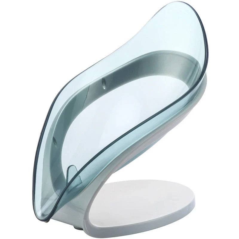 Elegant leaf-shaped soap dish with self-draining design and stable triangular shape, made of durable ABS material